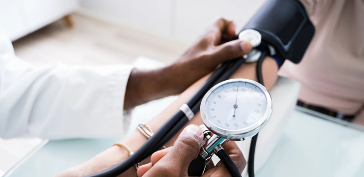 Doctor measuring blood pressure.