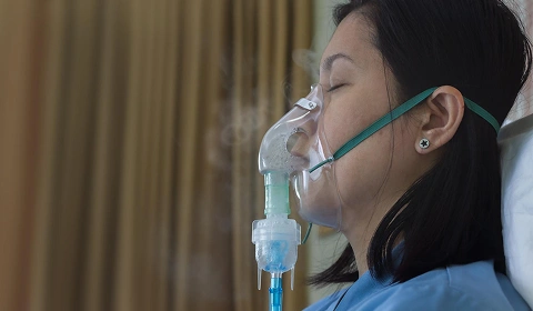 Woman using nebulizer