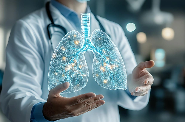 Doctor holding a digital hologram of human lungs.